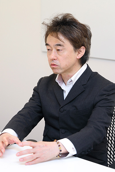 写真：Mr. Ken Sakurai, President & CEO of QSTO Communications