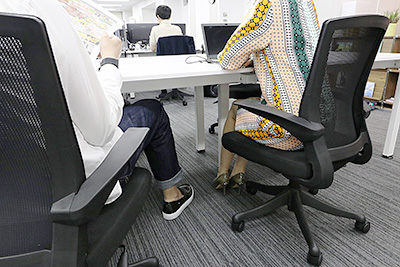 The foot space underneath desks in the office space is kept clear to avoid permanent fixation of employee working locations