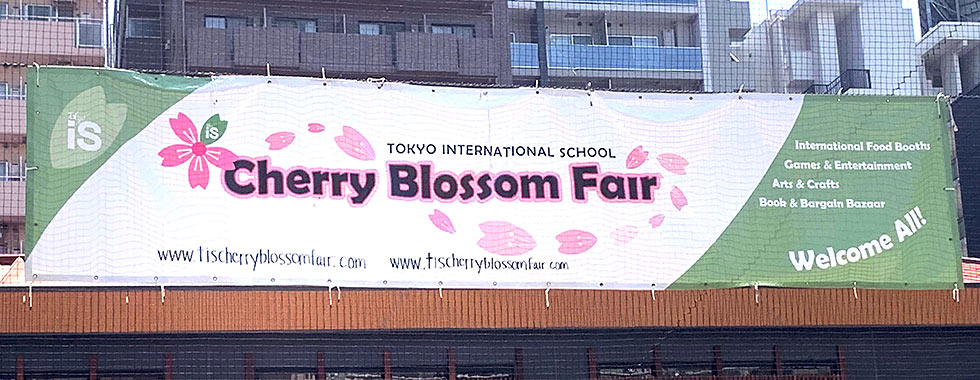 Festival banner - 'Tokyo International School Cherry Blossom Fair - Welcome All!'